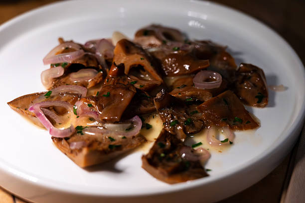 marinated wild mushrooms (Lactarius deliciosus, also delicious milk cap, saffron milk cap) on a plate in a restaurant