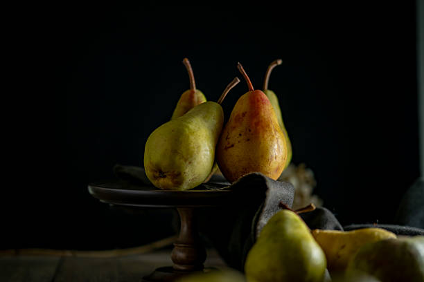 istock Still Life with Pears on Dark Background 2236521226