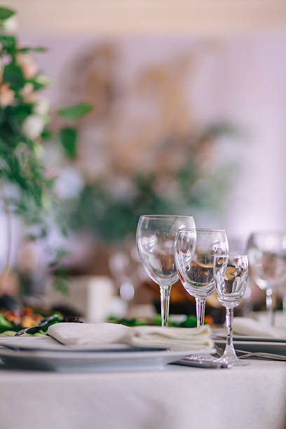 istock Empty glasses set in restaurant. Luxury elegant table setting dinner in a restaurant. glasses and dishes. 2236522400