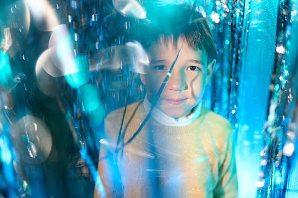 Boy Seen Through Perforated Metal