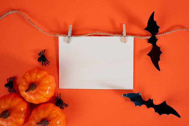 istock Halloween mockup with blank card, pumpkins and bats 2236525635