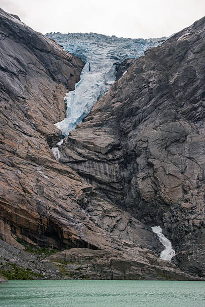 istock View of Briksdalsbreen glacier and Briksdalselva river (Norway) 2236529584