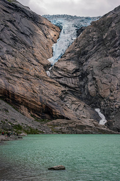 istock View of Briksdalsbreen glacier and Briksdalselva river (Norway) 2236529628