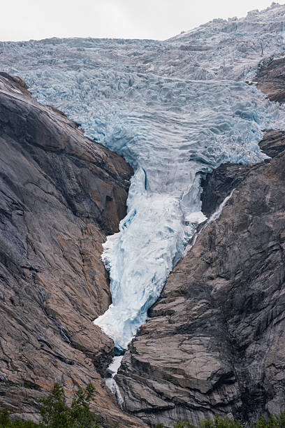istock View of Briksdalsbreen glacier and Briksdalselva river (Norway) 2236529692
