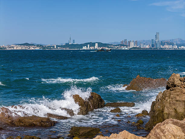 Viewing the skyline of the coastal city of Qingdao, China from the other side of the sea