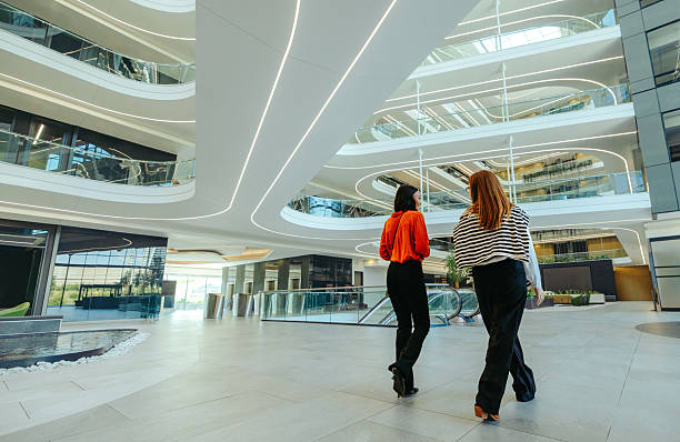 istock Modern accounting firm lobby with people walking inside 2236531687