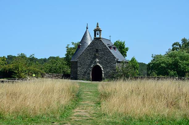 istock Small stone chapel in a meadow 2236533491