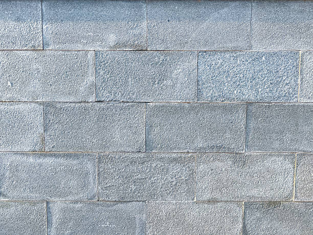 Gray Stone Wall With Textured Concrete Blocks For Architecture and Construction Background
