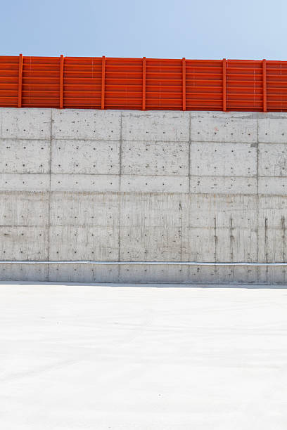 istock Minimalist Concrete Wall with Clear Blue Sky 2236538215