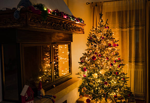 istock Decorated Christmas Tree by Fireplace with Lights 2236541944