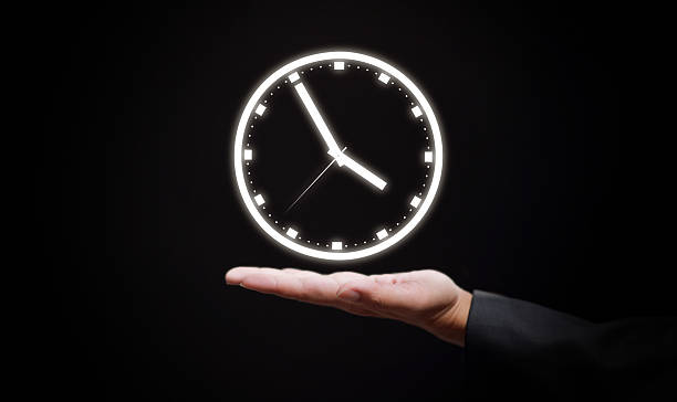 istock Business hand holding glowing clock symbolizing time management, business control, efficiency, deadline planning, productivity, leadership, and corporate success in modern workplace strategy. 2236546944