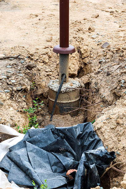 istock Construction Pit Featuring Newly Installed Urban Streetlight Pole, Highlighting Modern Urban Infrastructure Development and Safety Enhancements 2236547244