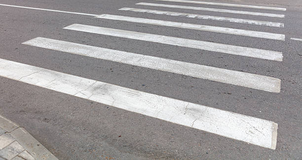 istock A white and black striped road with a white line 2236548239