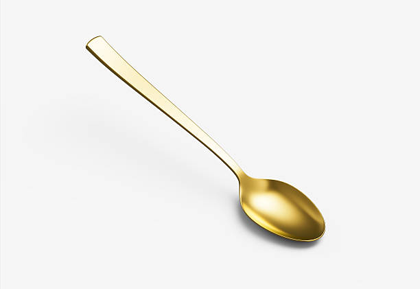 istock A shiny golden spoon with a reflective surface, slender handle and oval bowl. 3D Illustration. 2236549418