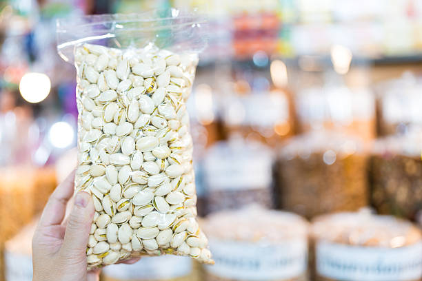 istock Freshly pistachio nuts in a transparent plastic pack 2236553540