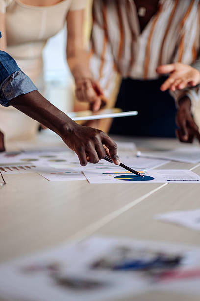 istock Collaborative Team Discussing Data and Analyzing Charts Together in a Meeting 2236553808
