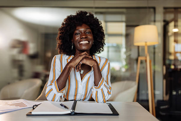 istock Confident Businesswoman Smiling During a Productive Day at Her Office 2236553842