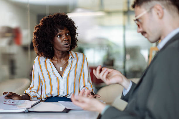 istock Business Discussion Between Colleagues in a Bright Office Environment 2236553844