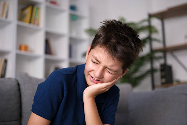 a little boy who felt bad because of his toothache