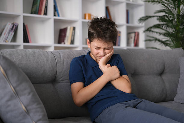 a little boy who felt bad because of his toothache