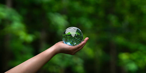 istock Hand holding crystal globe and environment, save the world, earth day, ecology and global environmental conservation concept. 2236558603