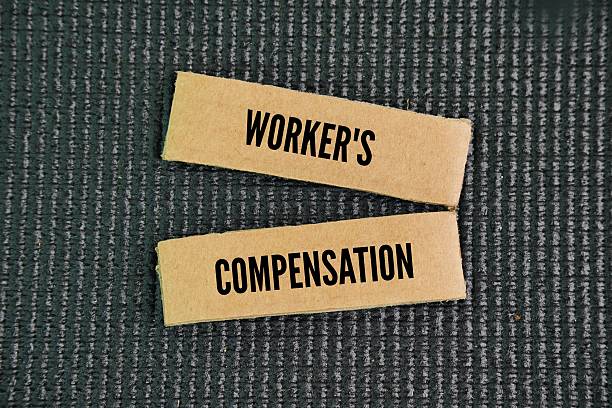 istock Paper with the words workers' compensation. labor worker concept. provides compensation for employees injured or who fall ill due to their work 2236559183