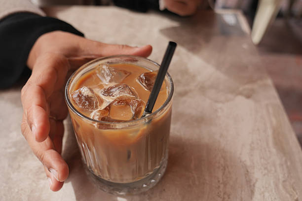 istock Enjoying ice coffee at a cozy cafe during a warm afternoon 2236567768