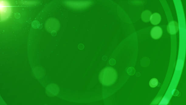 Defocused lights, sparkles, bokeh over green background