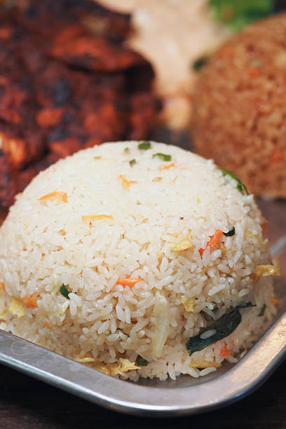 istock Fluffy rice served with grilled chicken and vegetable dish 2236572797