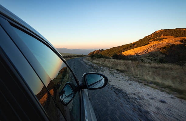 Car driving on a scenic road