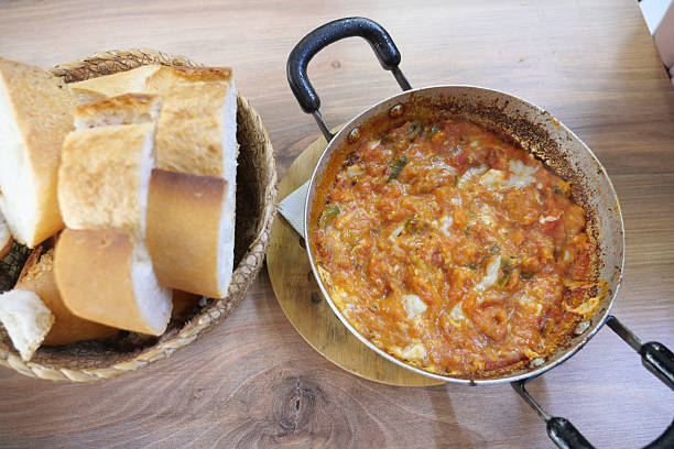 Delicious menemen served with fresh bread in a cozy eatery