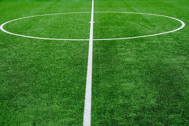 istock Soccer field with green grass and white line 2236577772