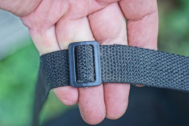 istock hand hold a one closed small black plastic carabiner on a harness 2236579668