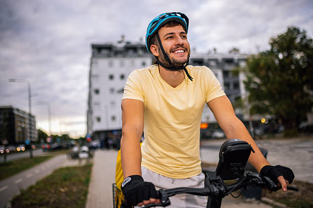 istock Courier on bicycle rides through urban streets, carrying delivery backpack, concept of fast food delivery, urban transport, courier job, modern city lifestyle. 2236582010