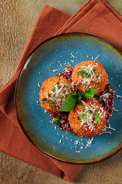 istock Crispy Arancini appetizer, with parmesan cheese and microgreens, plate, tomato sauce, homemade, no people, 2236587959