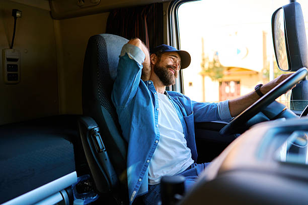 istock Truck driver feeling neck pain from long hours driving 2236588308