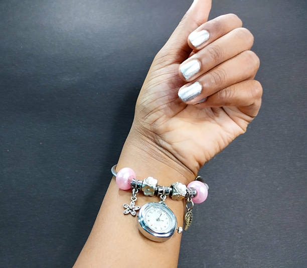 istock Stylish Charm Bracelet Watch In Hand 2236588309