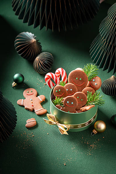 istock Cute Christmas gingerbread mans with candy cane. 2236588940