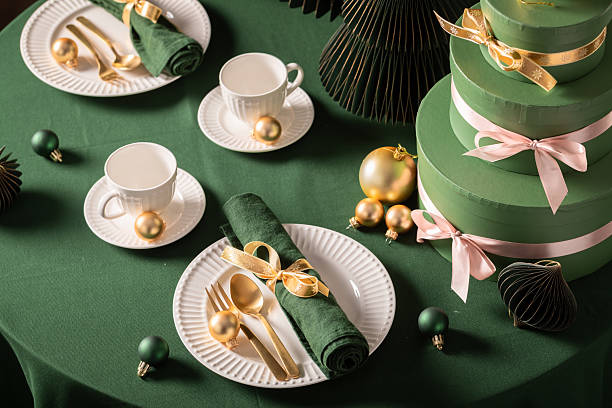 istock Exclusive green Christmas table set with gifts and bubbles. 2236588941