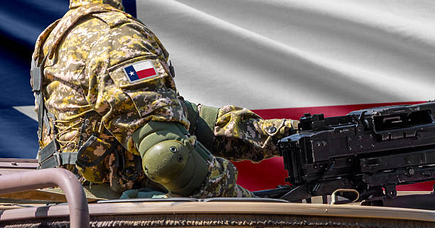 istock Texas US state flag with soldier at machinegun turret 2236589176