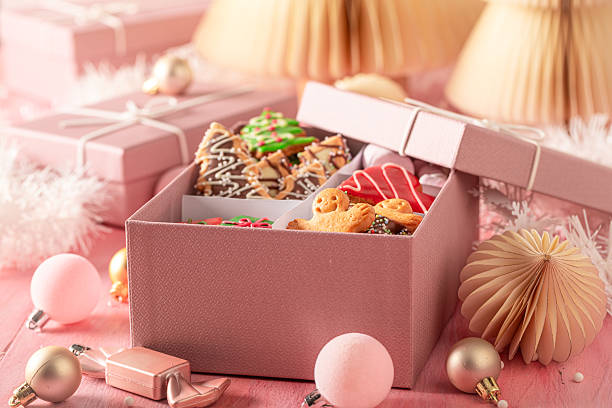 istock Cute Christmas gingerbread cookies in pink present box.. 2236589305
