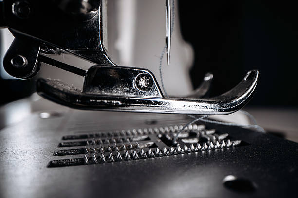 Unrecognizable person sewing using sewing machine