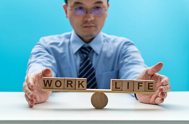 istock Wooden seesaw with word life and work 2236590041