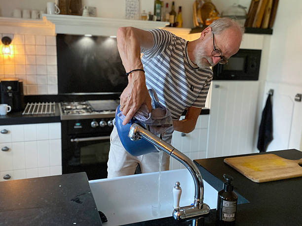 istock Senior Man making Endive Stew on a Sunday afternoon. 2236591111