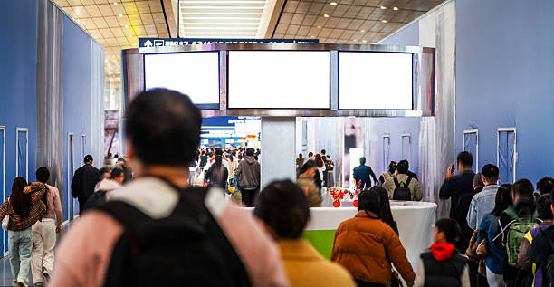 istock Motion blur of crowded commuters walking at airport terminal boarding gate 2236592500