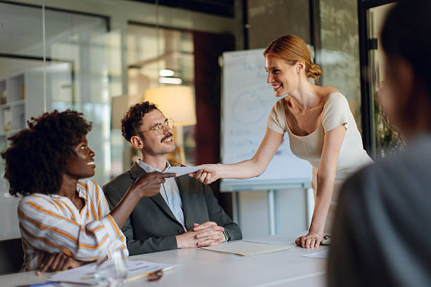 istock Team Members Collaborating and Smiling During a Modern Office Meeting 2236594776
