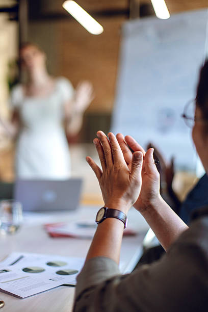 istock Colleagues Applauding During a Presentation in a Modern Office Setting 2236594786