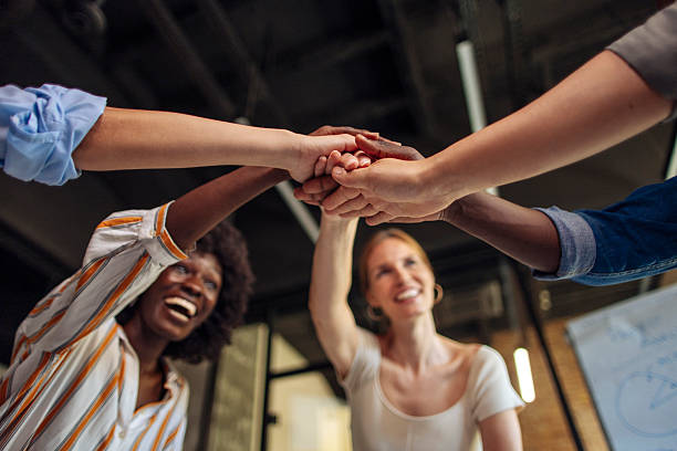 istock Team Celebrating Success with a Unified Gesture in a Modern Office Environment 2236594799