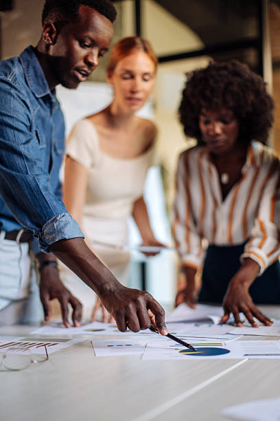 istock Diverse Team Collaborating on a Business Project in a Modern Office 2236594840