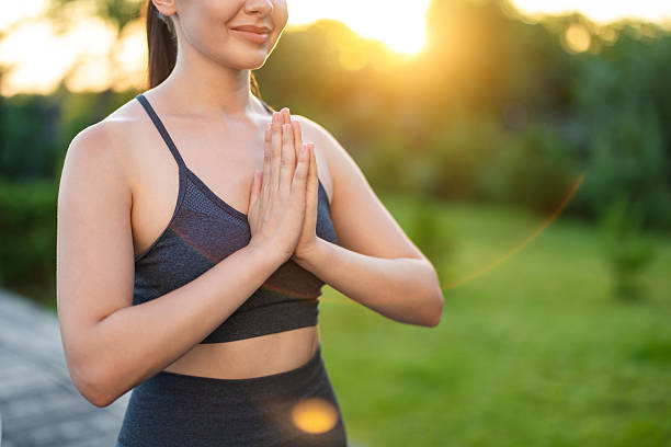 istock Young yogini standing with her hands in namaste 2236595037